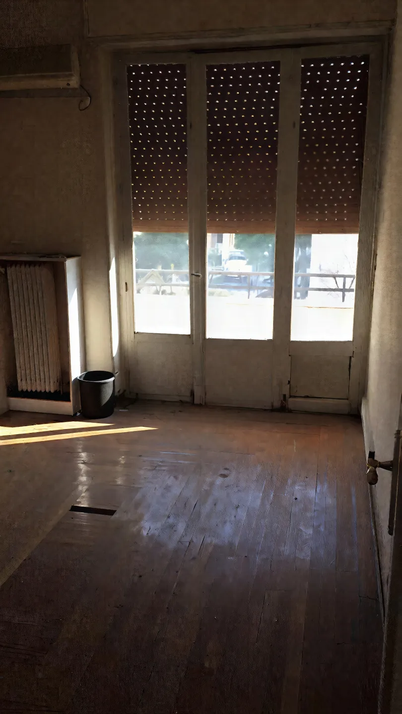 Bombyx — Balcony doors and timber floor before renovation