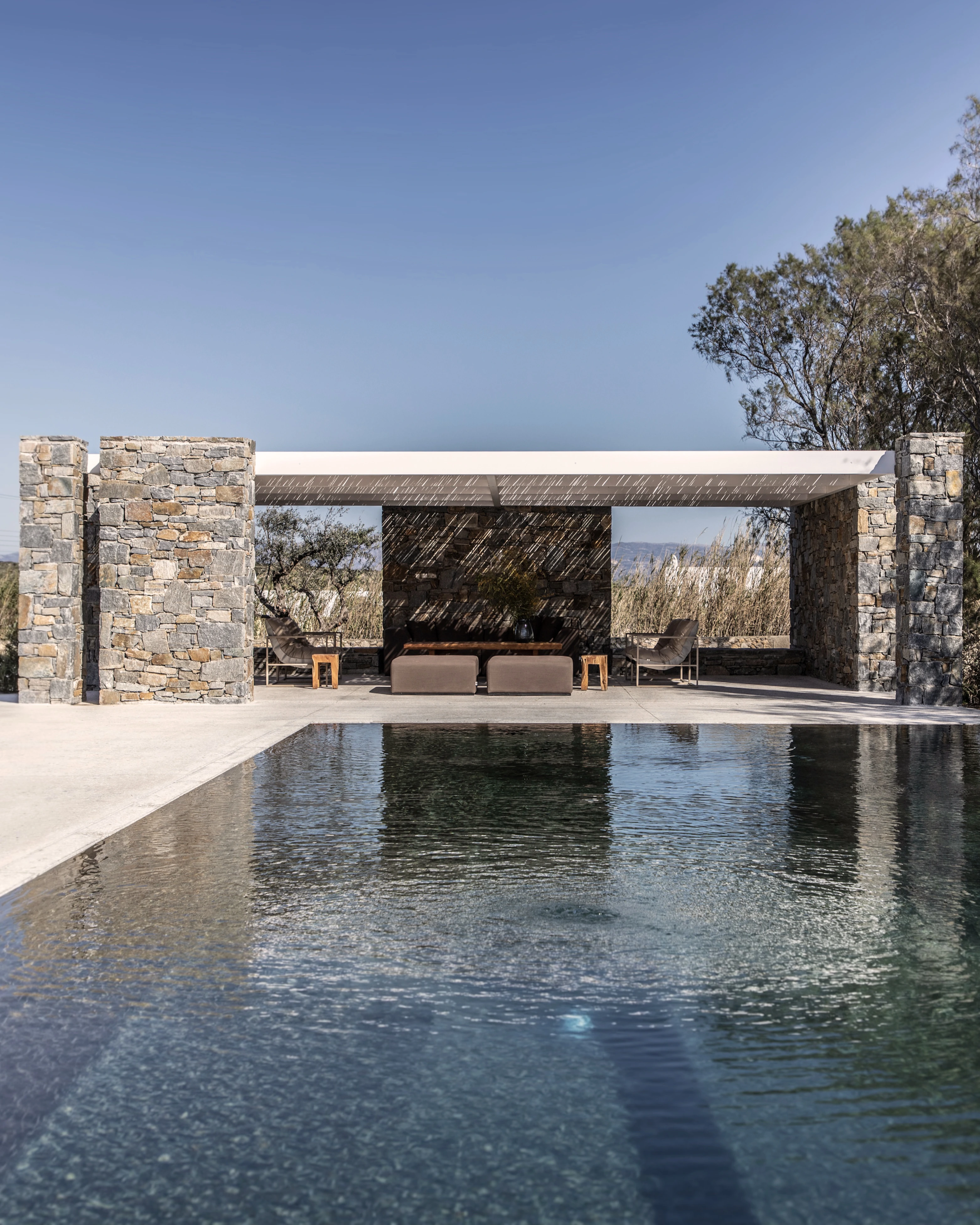 Santa Maria — stone pavilion and pergola reflected in the pool